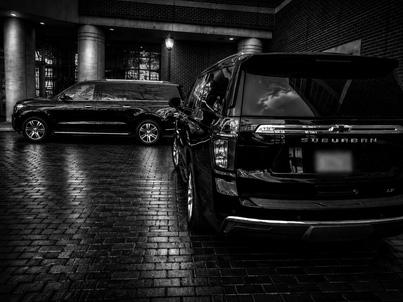 Executive transport vehicles staged for secure client movement.